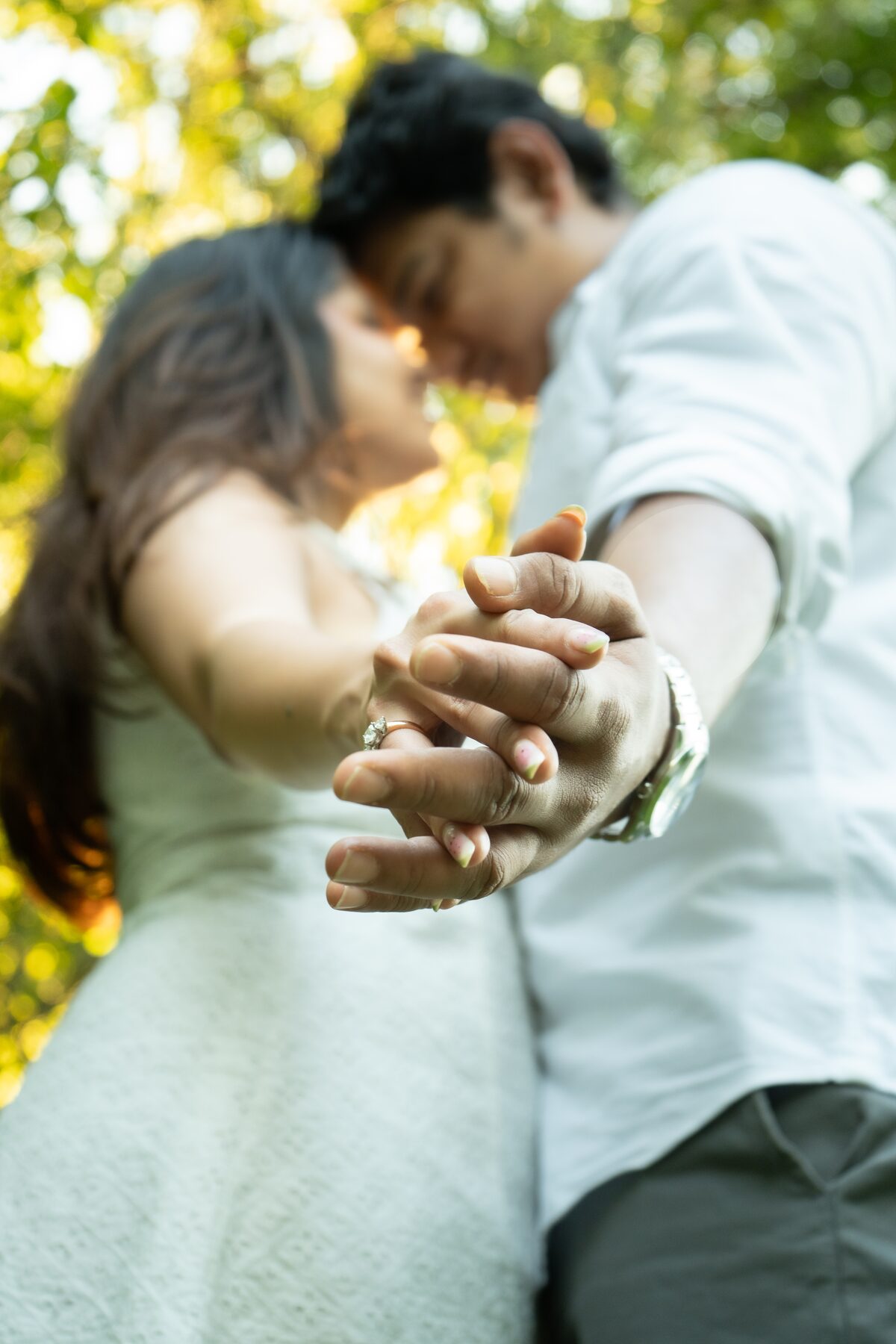 Couple hands clasped, low angle